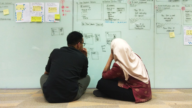 Mujib and Ina review participant's UI
